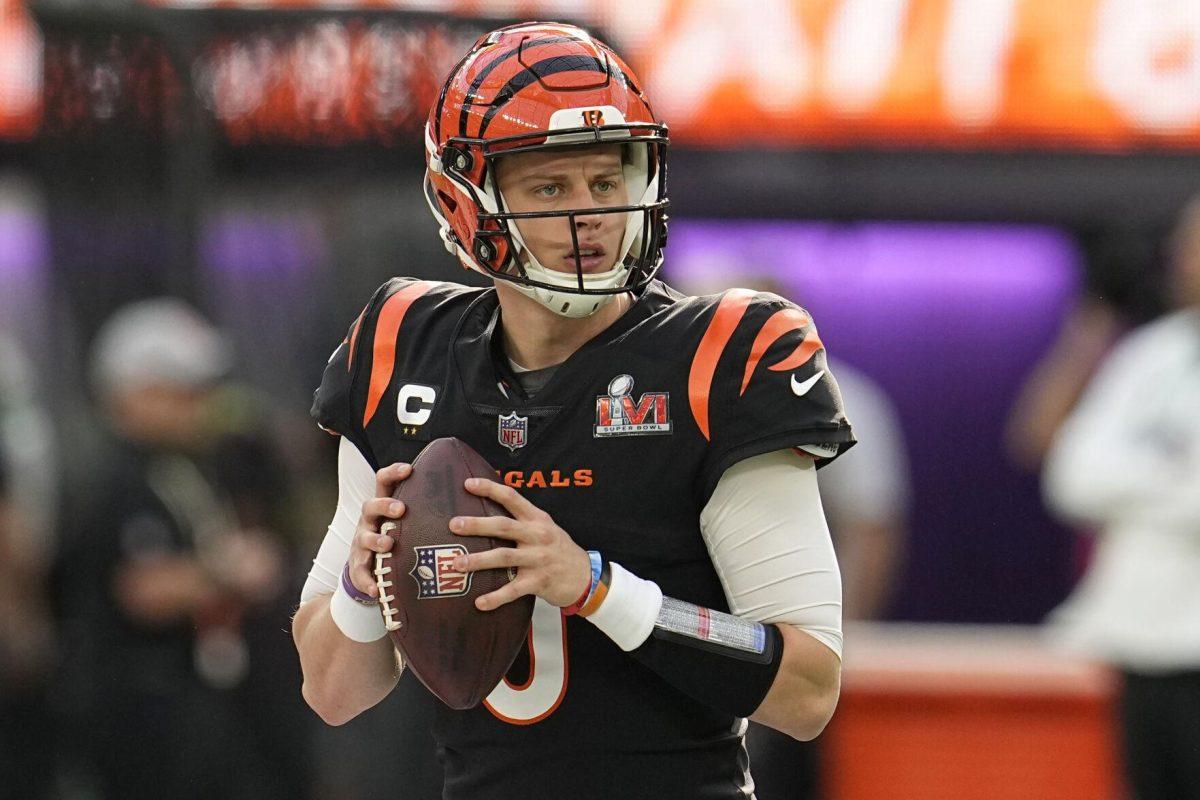 Cincinnati Bengals quarterback Joe Burrow (9) warms up before the NFL Super Bowl 56 football game against the Los Angeles Rams, Sunday, Feb. 13, 2022, in Inglewood, Calif. (AP Photo/Marcio Jose Sanchez)