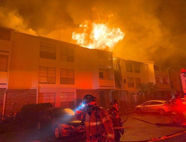 Baton Rouge firefighters respond to a large apartment fire at the Bradshaw Apartment Homes Friday night.&#160;