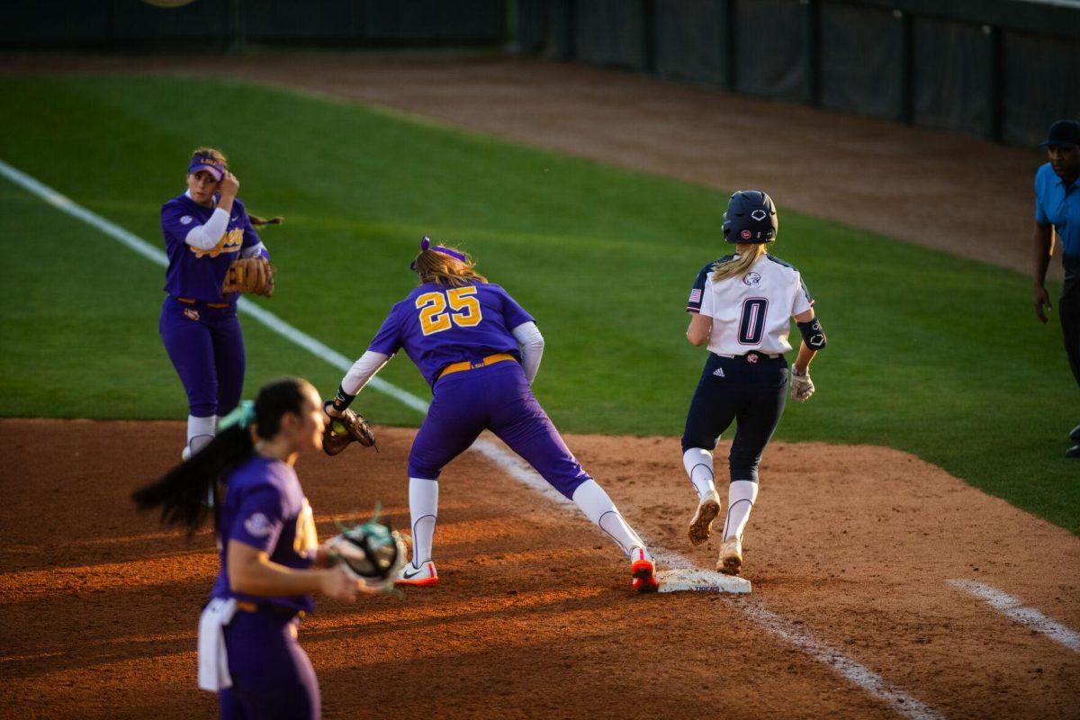 LSU softball redshirt junior infielder Georgia Clark (25) touches first base for the out Friday, Feb. 11, 2022, during the Tigers' 3-0 win against South Alabama at Tiger Park in Baton Rouge, La.