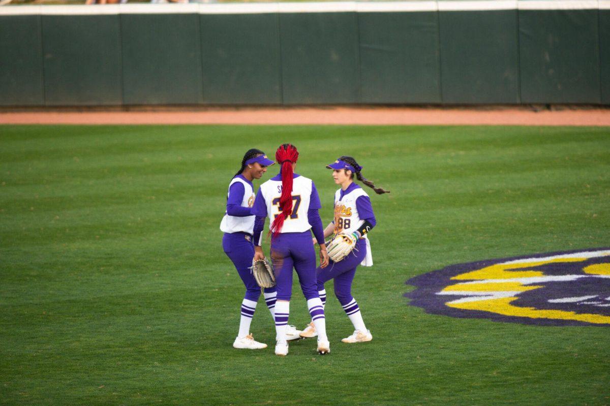 LSU junior outfielder Karrington Houshmandzedah (84), sophomore pitcher Morgan Smith (37), and sophomore outfielder Ciara Briggs (88) dance to “Callin Baton Rouge” Saturday, Feb. 12, 2022, during LSU’s 8-1 win against South Alabama at Tiger Park on Skip Bertman Drive in Baton Rouge, La.