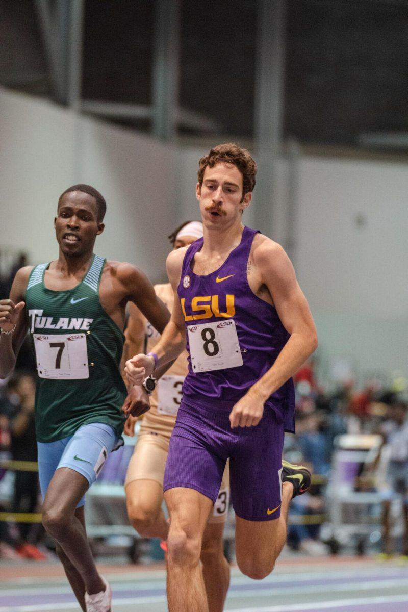 LSU track and field sophomore Garrett Hamilton complete a lap on Friday, Feb. 4, 2022, during the Bayou Bengal indoor track meet at the Carl Maddox Field House on Nicholson Drive in Baton Rouge, La.