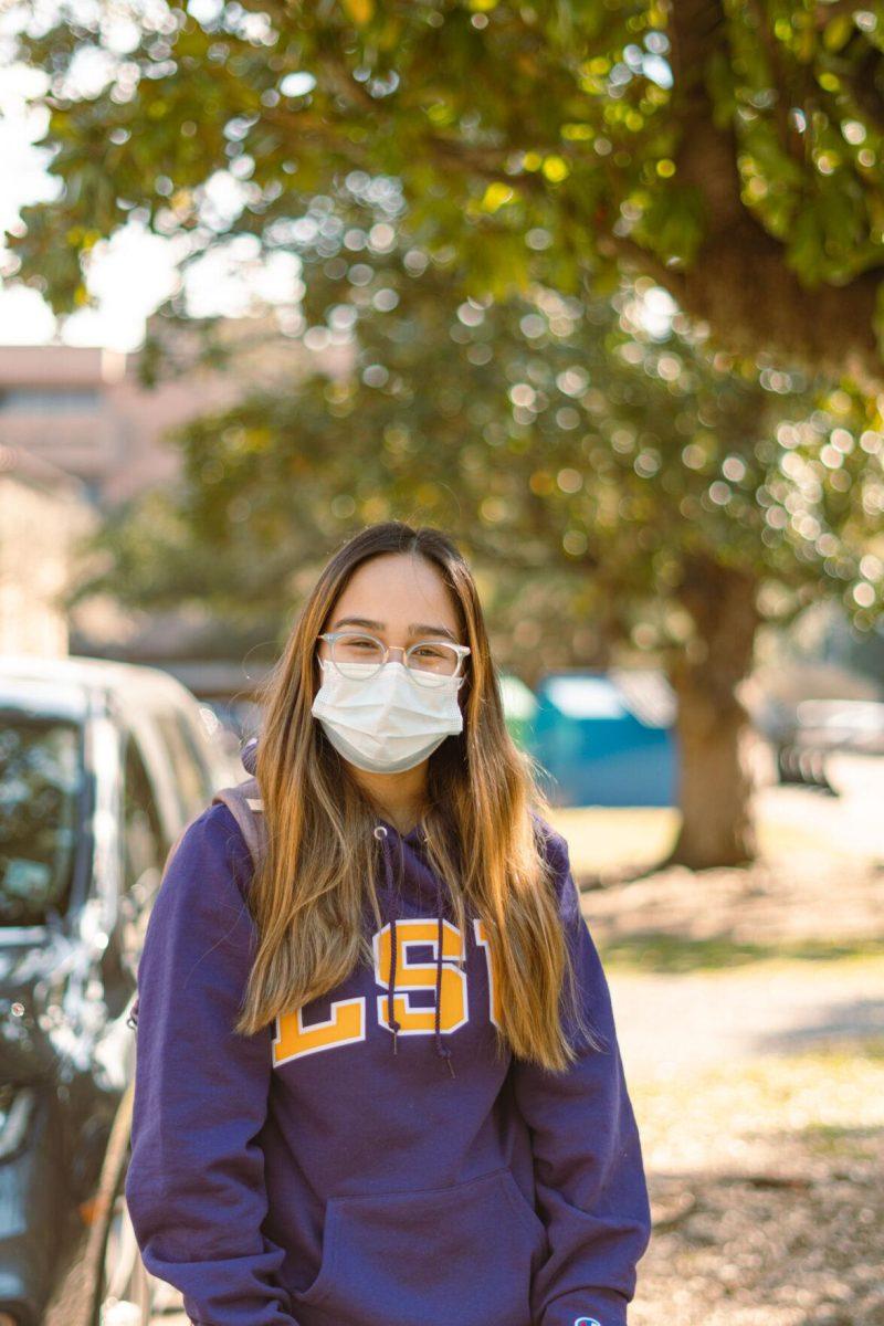 LSU international trade and finance freshman Christiana Rodriguez smiles on Tuesday, Feb. 15, 2022, as she wears her LSU sweatshirt near Lockett Hall in Baton Rouge, La.