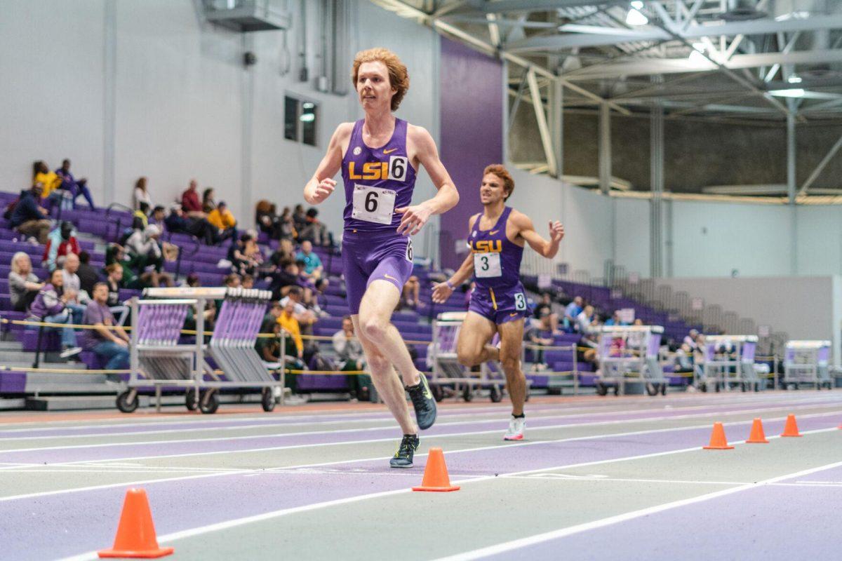 LSU track and field distance sophomore Cade Martin crosses the finish line on Friday, Feb. 18, 2022, during the LSU Twilight track and field meet in the Carl Maddox Field House on Nicholson Drive in Baton Rouge, La.