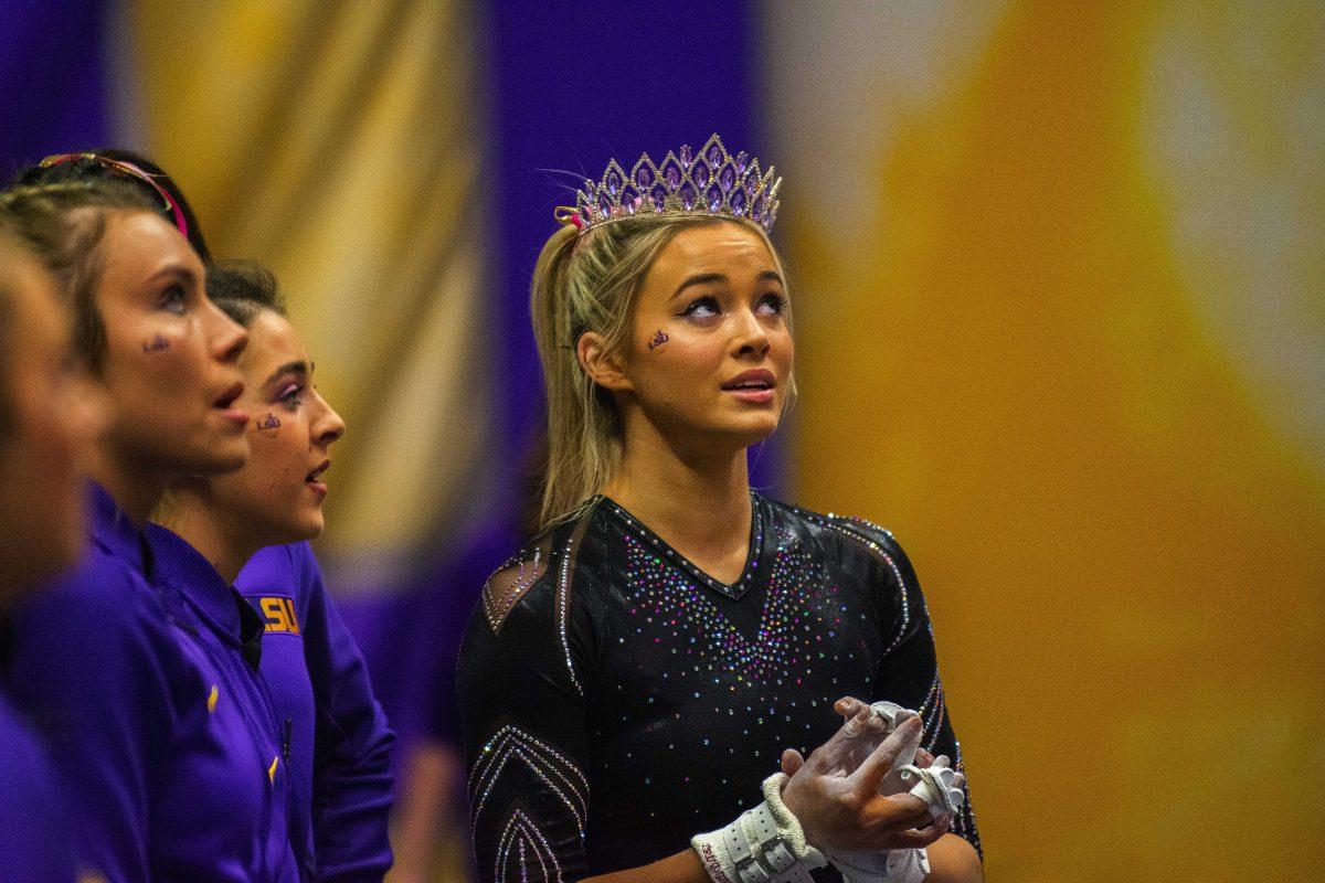 LSU gymnastics freshman all-around Olivia Dunne looks at the scoreboard to see her results Saturday, Feb. 5, 2022 during LSU's 197.975-197.750 win over Auburn in the Pete Maravich Assembly Center on N. Stadium Drive in Baton Rouge, La.