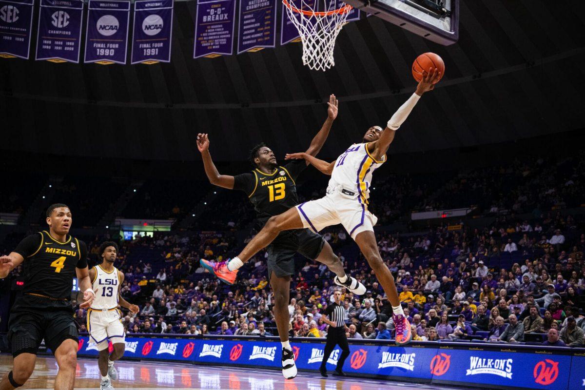 LSU men&#8217;s basketball freshman guard Justice Williams (11) gets fouled while attempting a layup Saturday, Feb. 26, 2022, during LSU&#8217;s 75-55 win against Missouri in the Pete Maravich Assembly Center on North Stadium Drive in Baton Rouge, La.