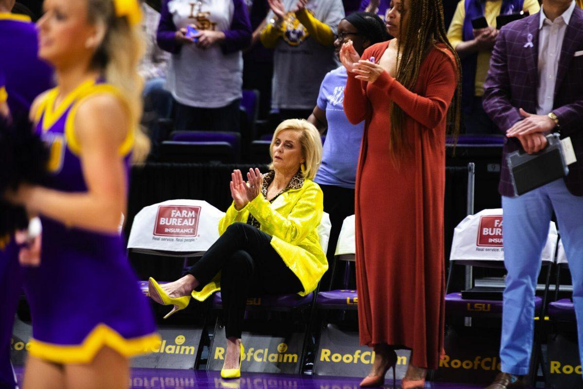 LSU women’s basketball head coach Kim Mulkey calps while sitting on the LSU bench Sunday, Feb. 20, 2022, before LSU’s 66-61 win against Florida in the Pete Maravich Assembly Center on North Stadium Drive in Baton Rouge, La.