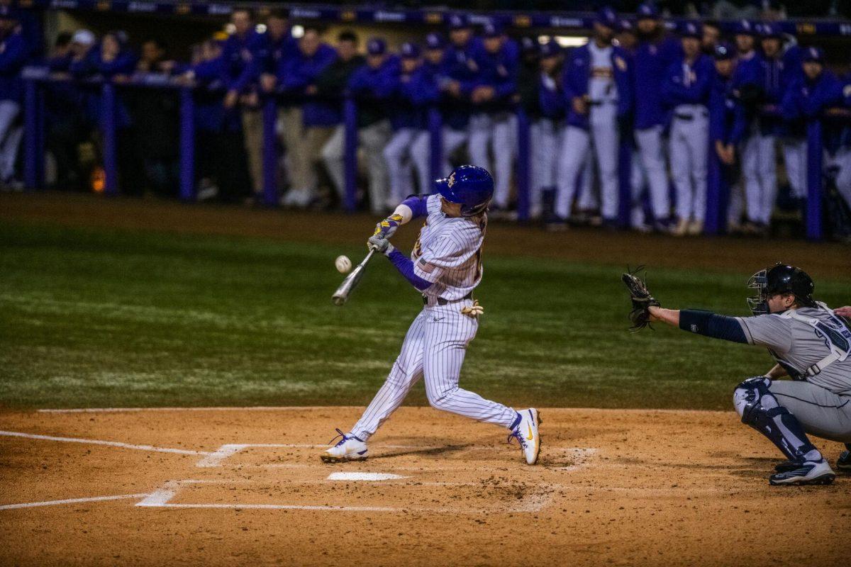 LSU baseball sophomore infielder William Safford (17) hits the ball Friday, Feb. 18, 2022 during LSU's 13-1 win against Maine at Alex Box Stadium on Gourrier Avenue in Baton Rouge, La.