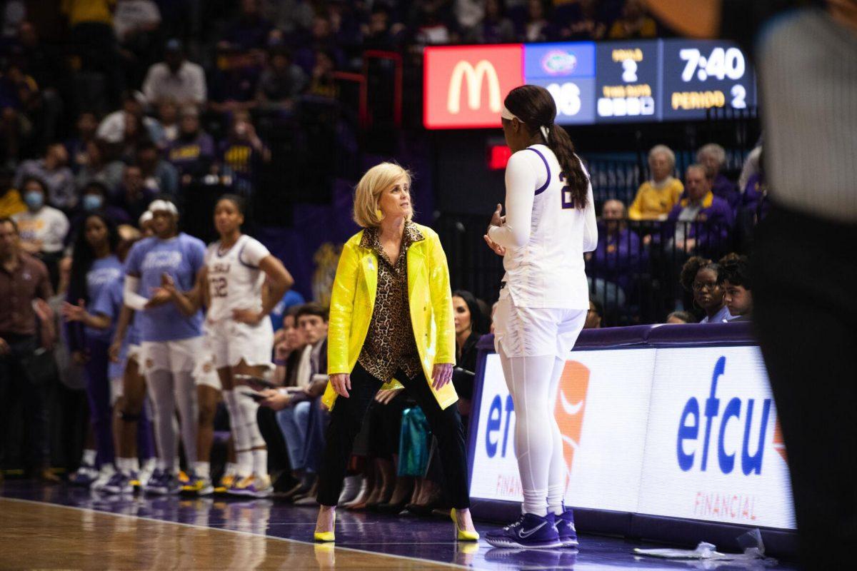 LSU women's basketball head coach speaks with graduate student center Faustine Aifuwa (24) as she subs out of the game Sunday, Feb. 20, 2022, during LSU’s 66-61 win against Florida in the Pete Maravich Assembly Center on North Stadium Drive in Baton Rouge, La.