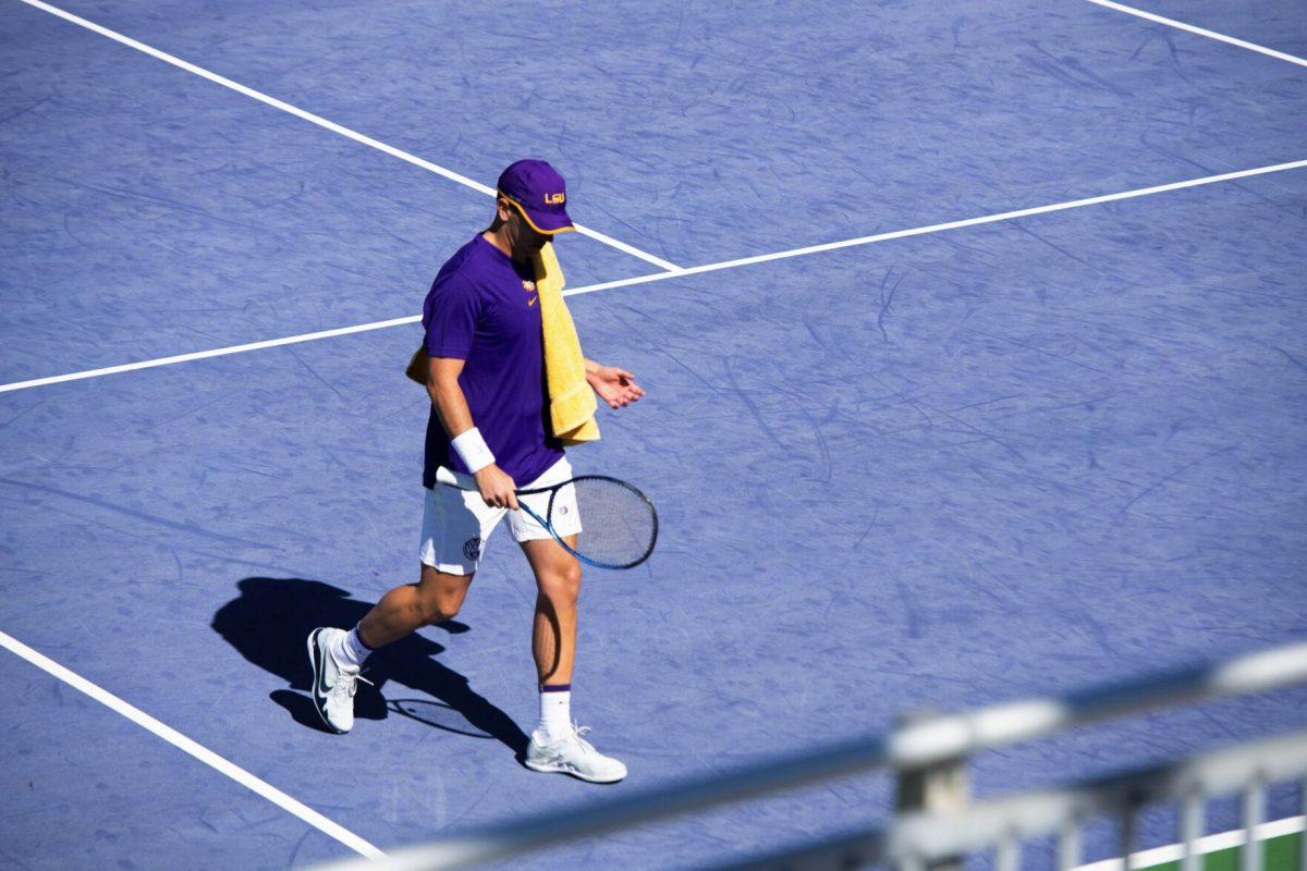 LSU men's tennis graduate student Gabriel Diaz Freire walks to his serving position Sunday, Feb. 13, 2021 during LSU's 6-1 win over Purdue at the LSU Tennis Complex on Gourrier Avenue in Baton Rouge, La.