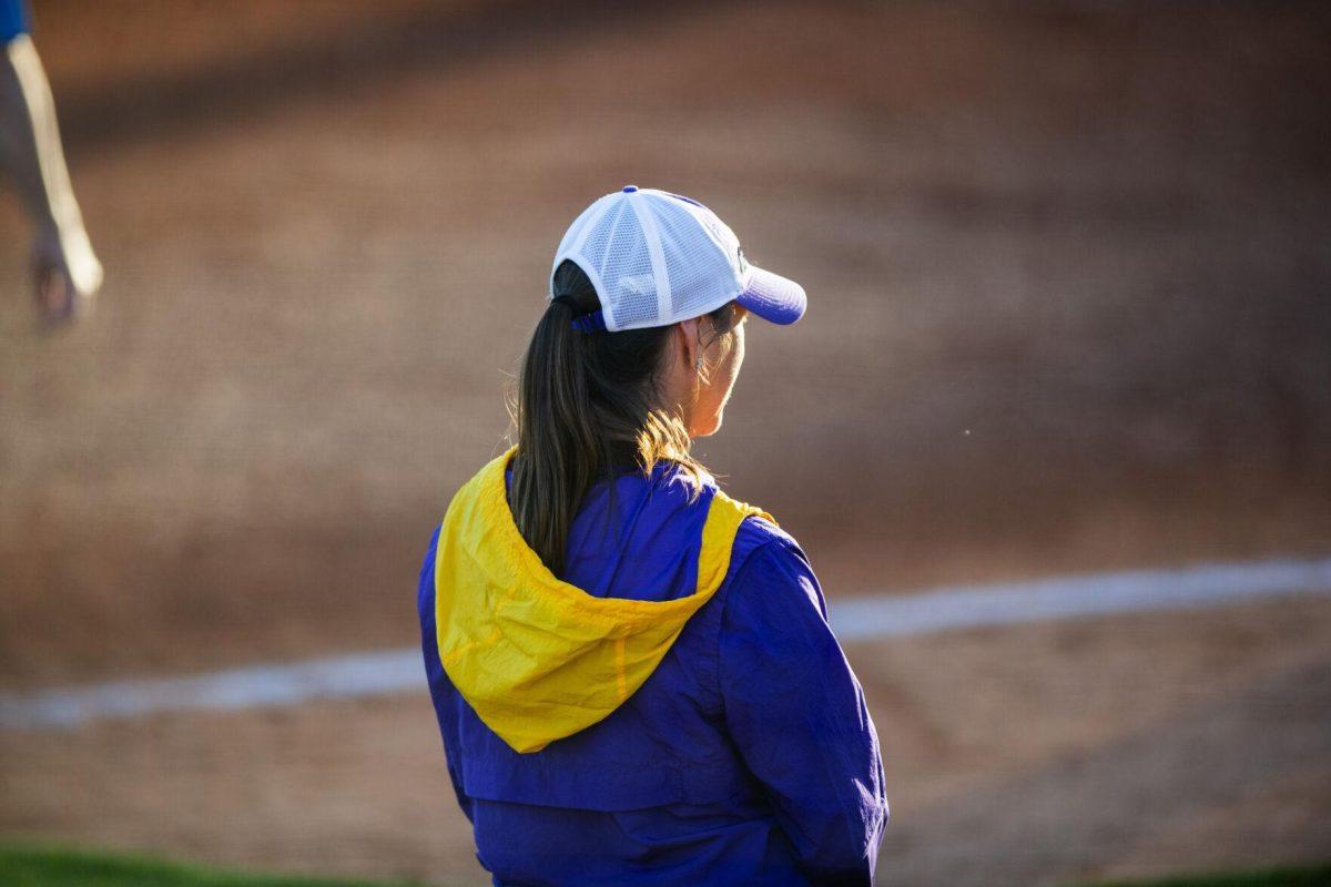 LSU softball head coach Beth Torina stands in the third base coaches box Friday, Feb. 11, 2022, during the Tigers' 3-0 win against South Alabama at Tiger Park in Baton Rouge, La.