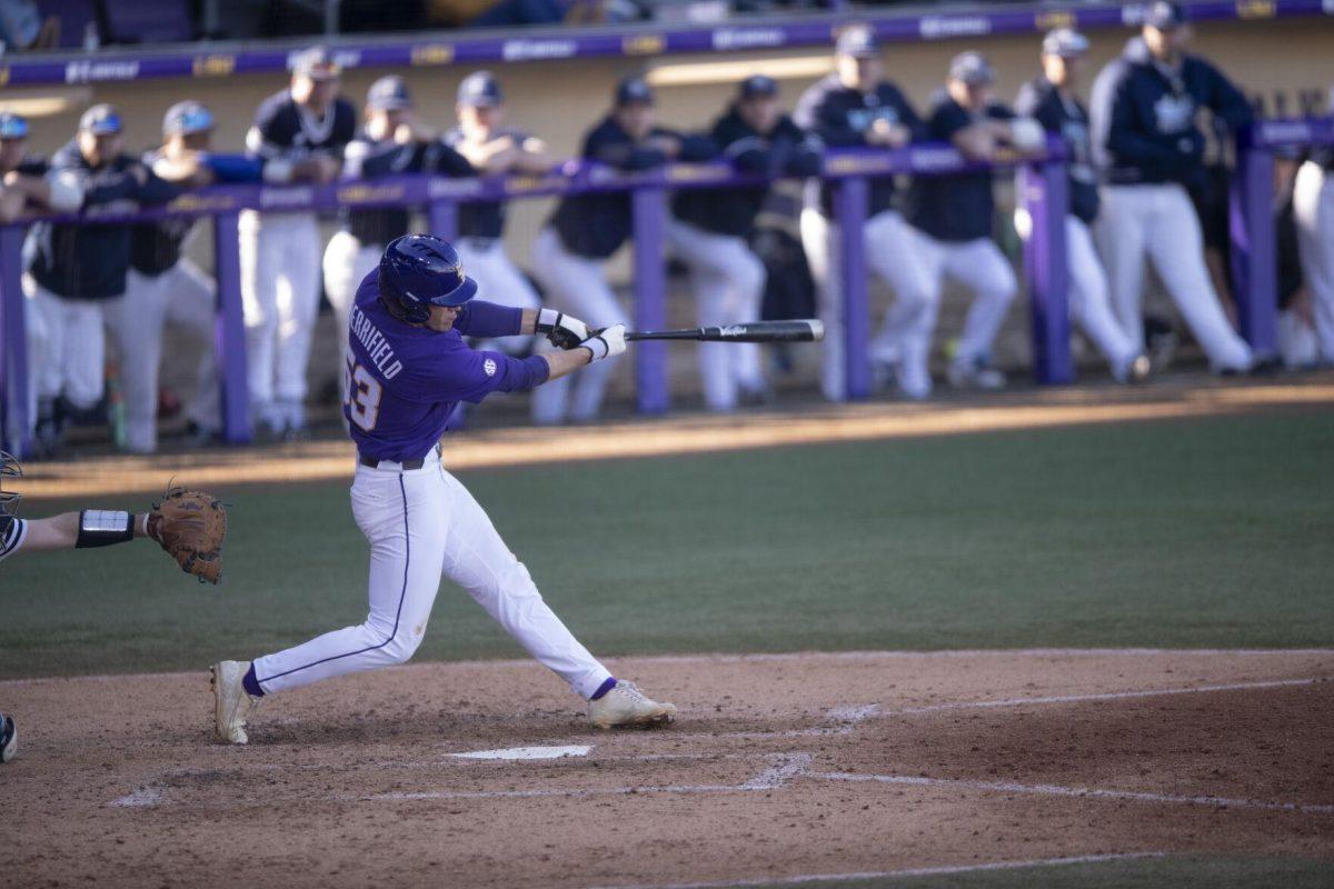 LSU sophomore infielder Jack Merrifield swings and hits the ball Saturday, Feb. 19, 2022, during the Tigers' 17-8 win against the University of Maine at Alex Box Stadium in Baton Rouge, La.