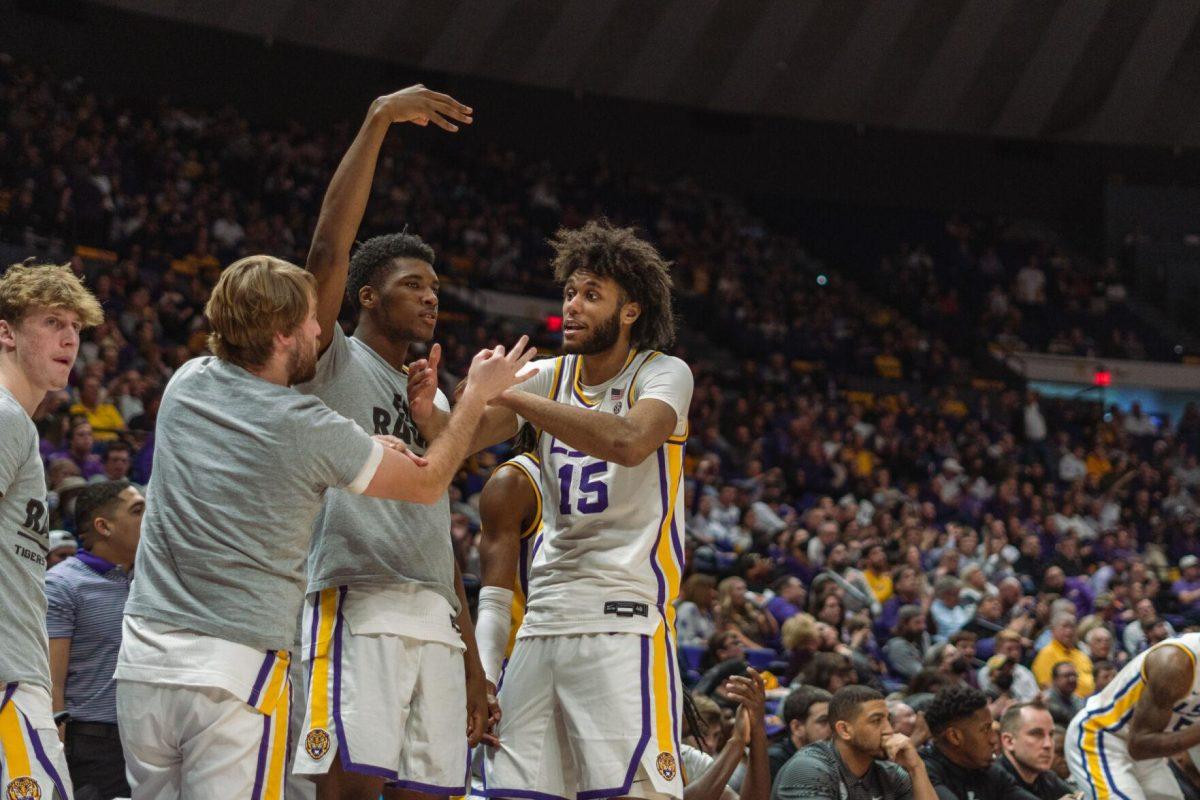 Several LSU men&#8217;s basketball players celebrate a basket on Saturday, Feb. 12, 2022, during LSU&#8217;s 69-65 win over Mississippi State at the Pete Maravich Assembly Center on North Stadium Drive in Baton Rouge, La.