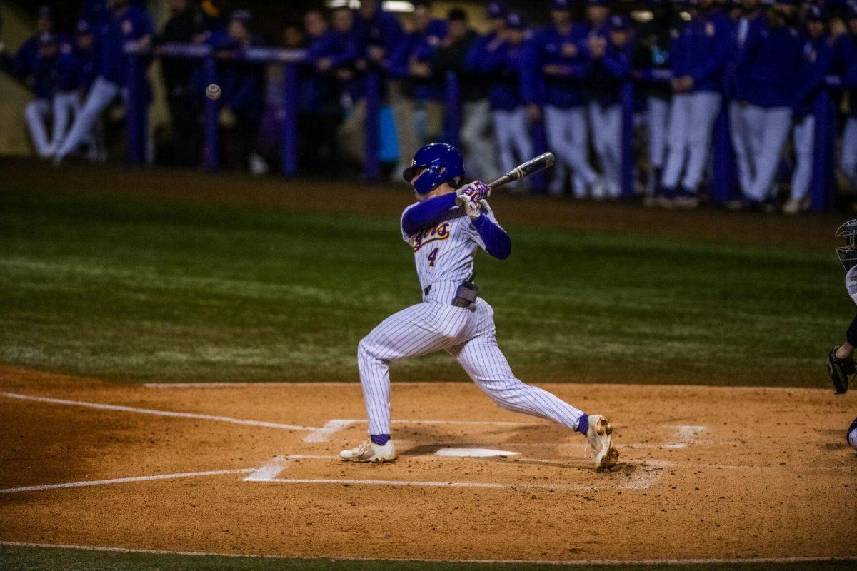 LSU baseball sophomore infielder Cade Doughty (4) hits the ball Friday, Feb. 18, 2022 during LSU's 13-1 win against Maine at Alex Box Stadium on Gourrier Avenue in Baton Rouge, La.