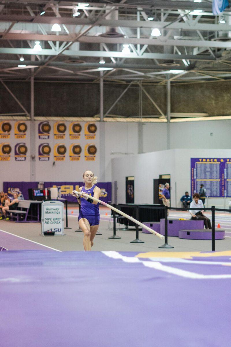 LSU track and field pole vault fifth-year senior Lisa Gunnarsson lowers the pole on Friday, Feb. 18, 2022, during the LSU Twilight track and field meet in the Carl Maddox Field House on Nicholson Drive in Baton Rouge, La.