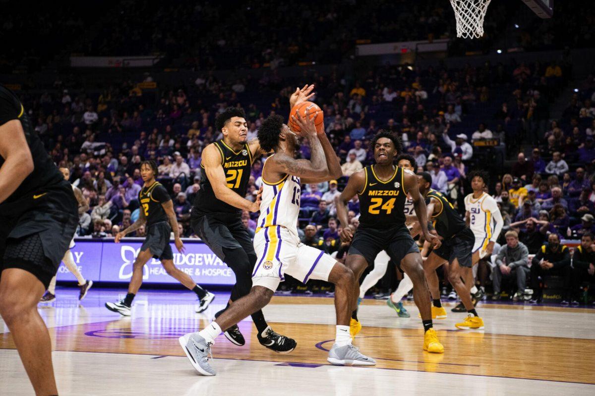 LSU men&#8217;s basketball sophomore forward Tari Eason (13) moves past a Missouri defender Saturday, Feb. 26, 2022, during LSU&#8217;s 75-55 win against Missouri in the Pete Maravich Assembly Center on North Stadium Drive in Baton Rouge, La.