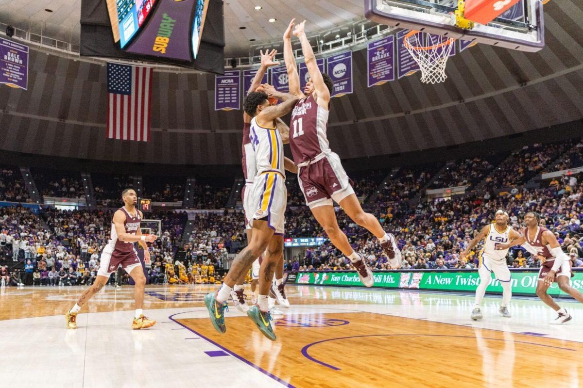 LSU men&#8217;s basketball junior forward Shareef O&#8217;Neal (24) collides with two Mississippi State players on Saturday, Feb. 12, 2022, during LSU&#8217;s 69-65 win over Mississippi State at the Pete Maravich Assembly Center on North Stadium Drive in Baton Rouge, La.