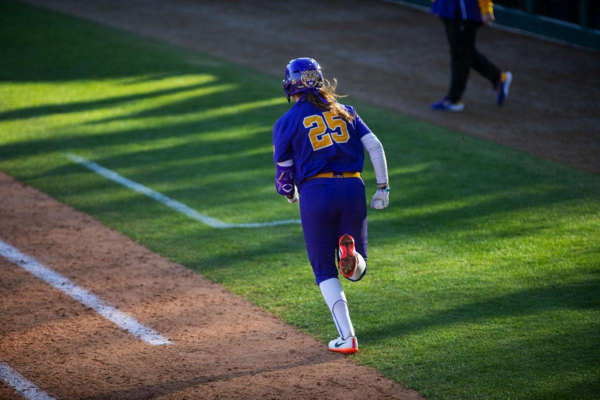 LSU softball redshirt junior infielder Georgia Clark (25) runs to first Friday, Feb. 11, 2022, during the Tigers' 3-0 win against South Alabama at Tiger Park in Baton Rouge, La.