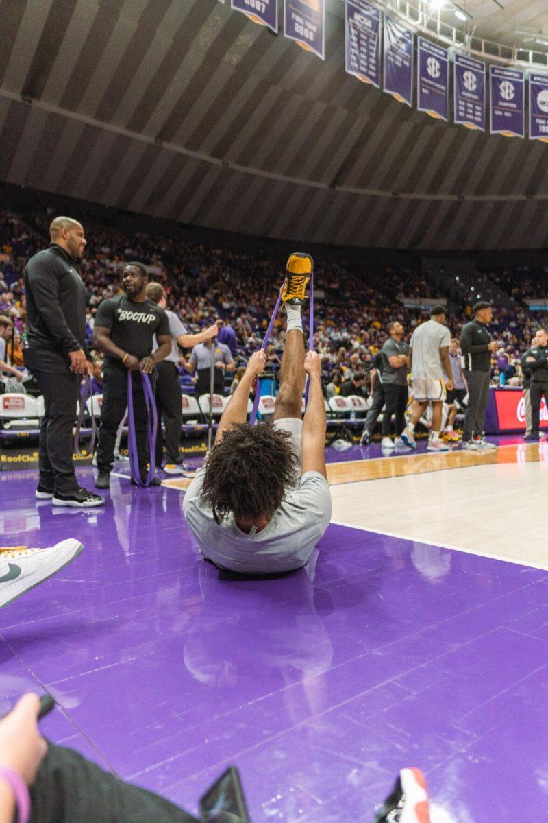 LSU men&#8217;s basketball freshman center Efton Reid (15) stretches during halftime on Saturday, Feb. 12, 2022, during LSU&#8217;s 69-65 win over Mississippi State at the Pete Maravich Assembly Center on North Stadium Drive in Baton Rouge, La.