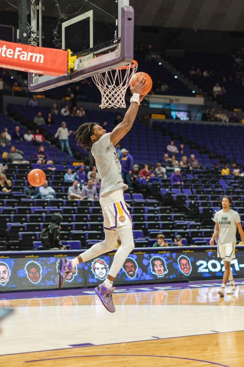 LSU men&#8217;s basketball freshman guard Justice Williams (11) dunks during warmups on Saturday, Feb. 12, 2022, during LSU&#8217;s 69-65 win over Mississippi State in the Pete Maravich Assembly Center on North Stadium Drive in Baton Rouge, La.