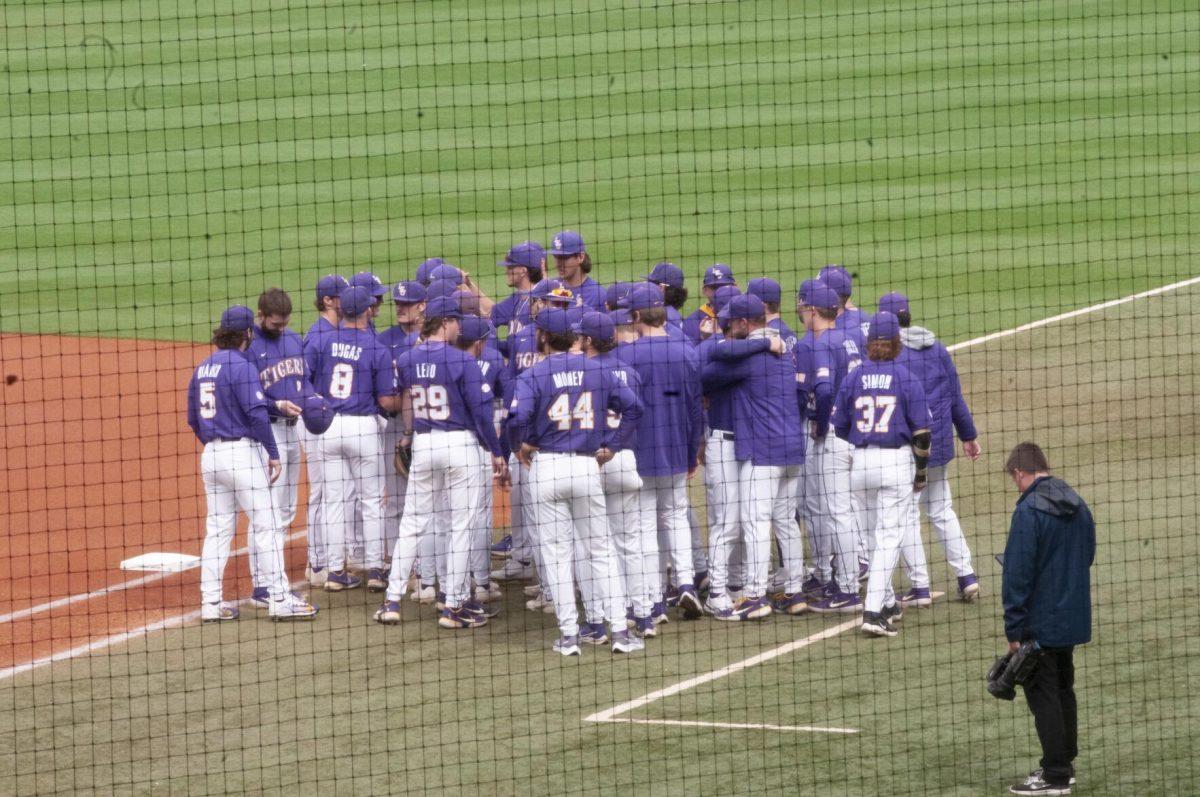 The LSU baseball team huddles before the game Saturday, Feb. 26, 2022, during the Tigers' 9-2 win against Southern University at Alex Box Stadium in Baton Rouge, La.