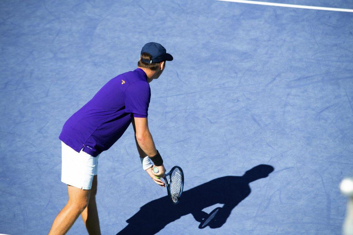 LSU men's tennis junior Boris Kozlov holds the ball before his serve Sunday, Feb. 13, 2021 during LSU's 6-1 win over Purdue at the LSU Tennis Complex on Gourrier Avenue in Baton Rouge, La.