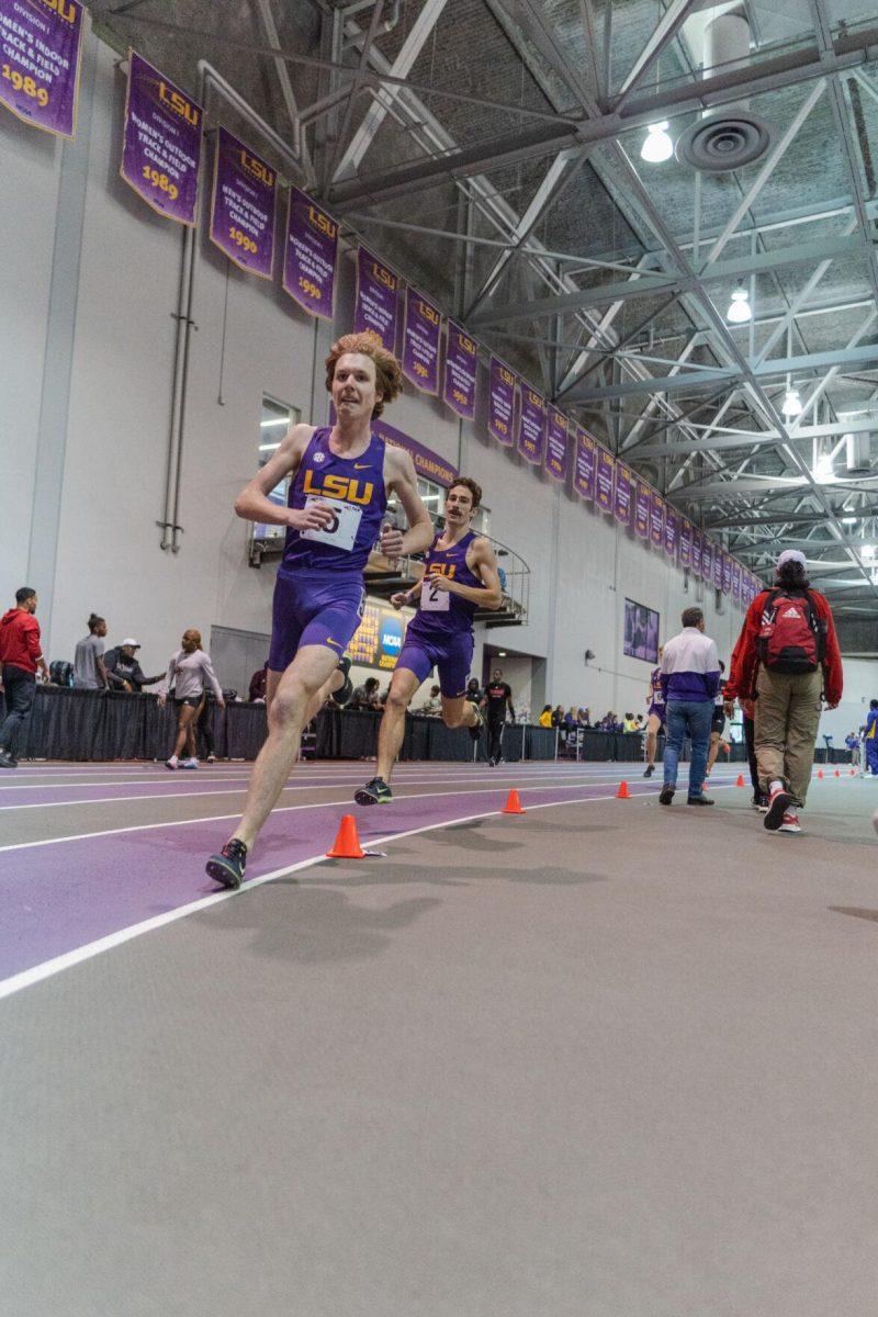 LSU track and field sophomores Cade Martin and Garrett Hamilton run into the curve on Friday, Feb. 4, 2022, during the Bayou Bengal indoor track meet at the Carl Maddox Field House on Nicholson Drive in Baton Rouge, La.