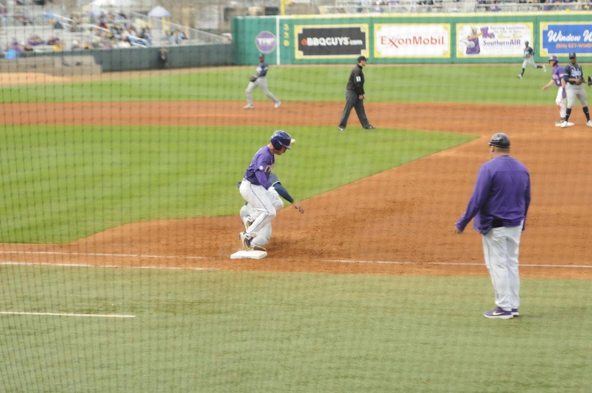 LSU sophomore catcher Alex Milazzo (20) runs to first base after the swing Saturday, Feb. 26, 2022, during the Tigers' 9-2 win against Southern University at Alex Box Stadium in Baton Rouge, La.