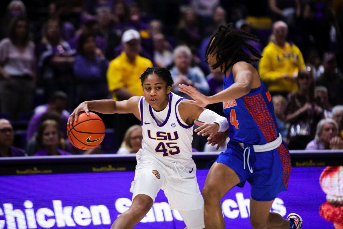 LSU women’s basketball fifth year senior guard Alexis Morris (45) tries to dribble past a Florida defender Sunday, Feb. 20, 2022, during LSU’s 66-61 win against Florida in the Pete Maravich Assembly Center on North Stadium Drive in Baton Rouge, La.