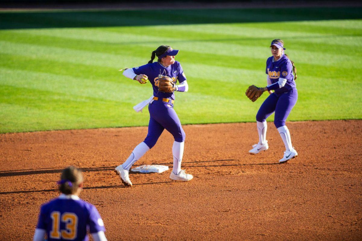 LSU softball redshirt sophomore infielder Taylor Pleasants (17) throws the ball to first Friday, Feb. 11, 2022, during the Tigers' 3-0 win against South Alabama at Tiger Park in Baton Rouge, La.