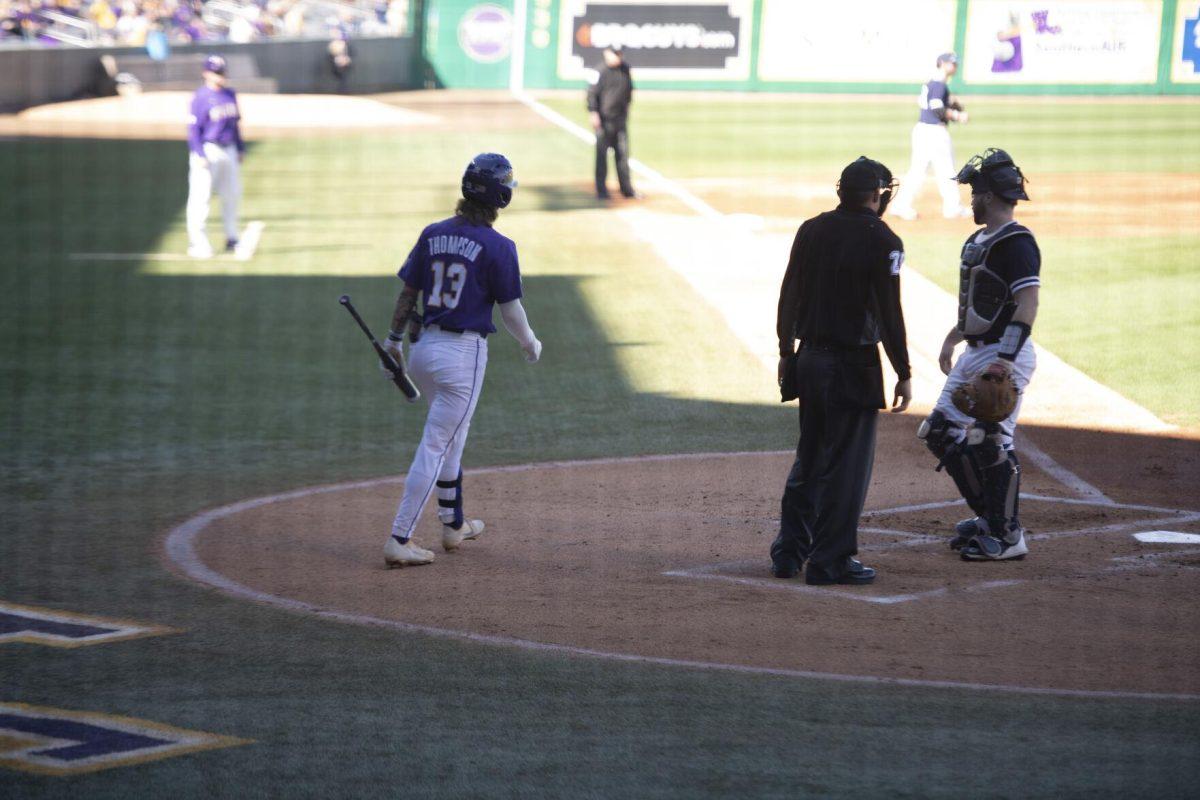 LSU sophomore infielder Jordan Thompson (13) walks to home plate Saturday, Feb. 19, 2022, during the Tigers' 17-8 win against the University of Maine at Alex Box Stadium in Baton Rouge, La.