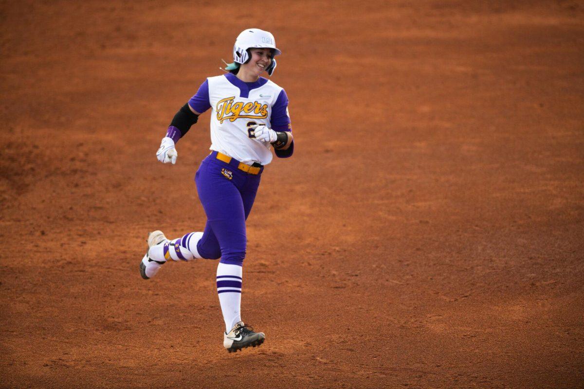 LSU softball fifth year senior pitcher/utility Shelbi Sunseri (27) smiles as she runs around the bases after hitting a homerun Saturday, Feb. 12, 2022, during LSU’s 8-1 win against South Alabama at Tiger Park on Skip Bertman Drive in Baton Rouge, La.