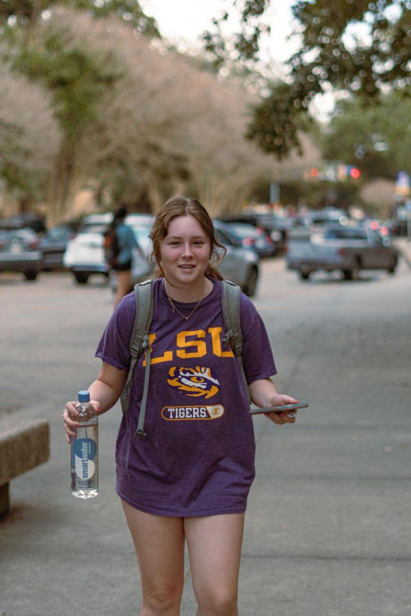 LSU freshman English literature major Chole Lawrence walks in front of the Student Union on Tuesday, Feb. 22, 2022, sporting an LSU Tigers t-shirt near Tower Drive in Baton Rouge, La.