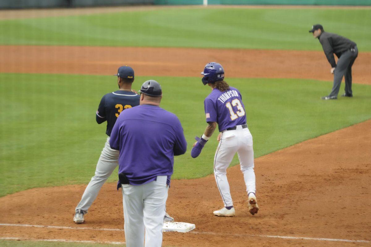 LSU sophomore infielder Jordan Thompson (13) and Southern University junior infielder O'Neill Burgos (32) wait for the pitch Saturday, Feb. 26, 2022, during the Tigers' 9-2 win against Southern University at Alex Box Stadium in Baton Rouge, La.