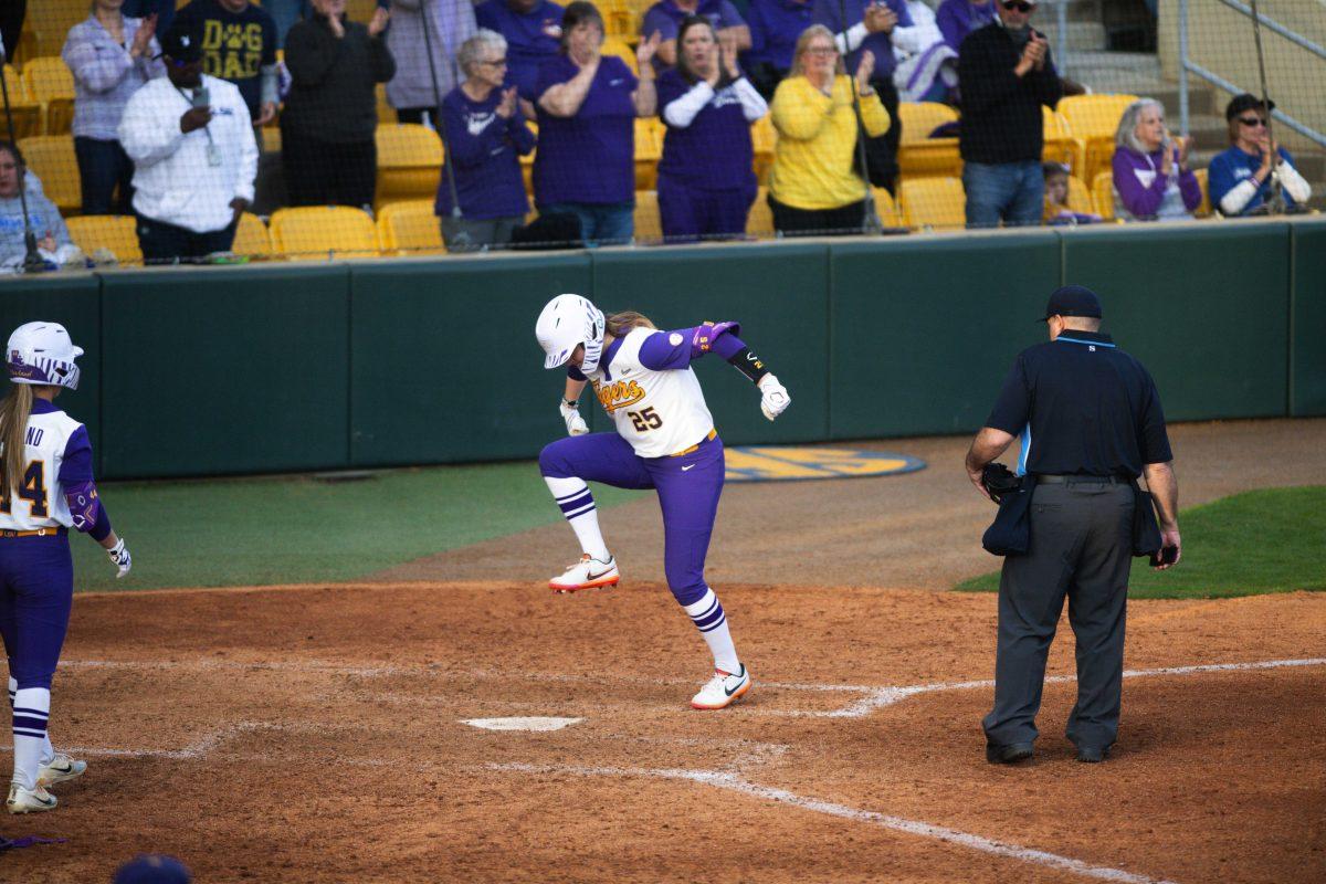 LSU softball junior infielder Georgia Clark (25) prepares to stomp on home plate after hitting a homerun Saturday, Feb. 12, 2022, during LSU&#8217;s 8-1 win against South Alabama at Tiger Park on Skip Bertman Drive in Baton Rouge, La.