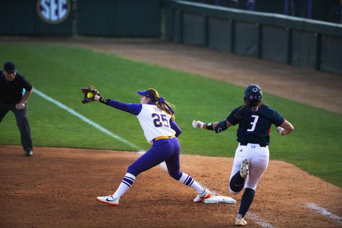 LSU softball junior infielder Georgia Clark (25) reaches out to catch the ball Saturday, Feb. 12, 2022, during LSU’s 8-1 win against South Alabama at Tiger Park on Skip Bertman Drive in Baton Rouge, La.