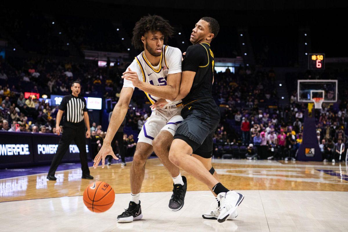 LSU men&#8217;s basketball freshman center Efton Reid (15) protects the ball Saturday, Feb. 26, 2022, during LSU&#8217;s 75-55 win against Missouri in the Pete Maravich Assembly Center on North Stadium Drive in Baton Rouge, La.