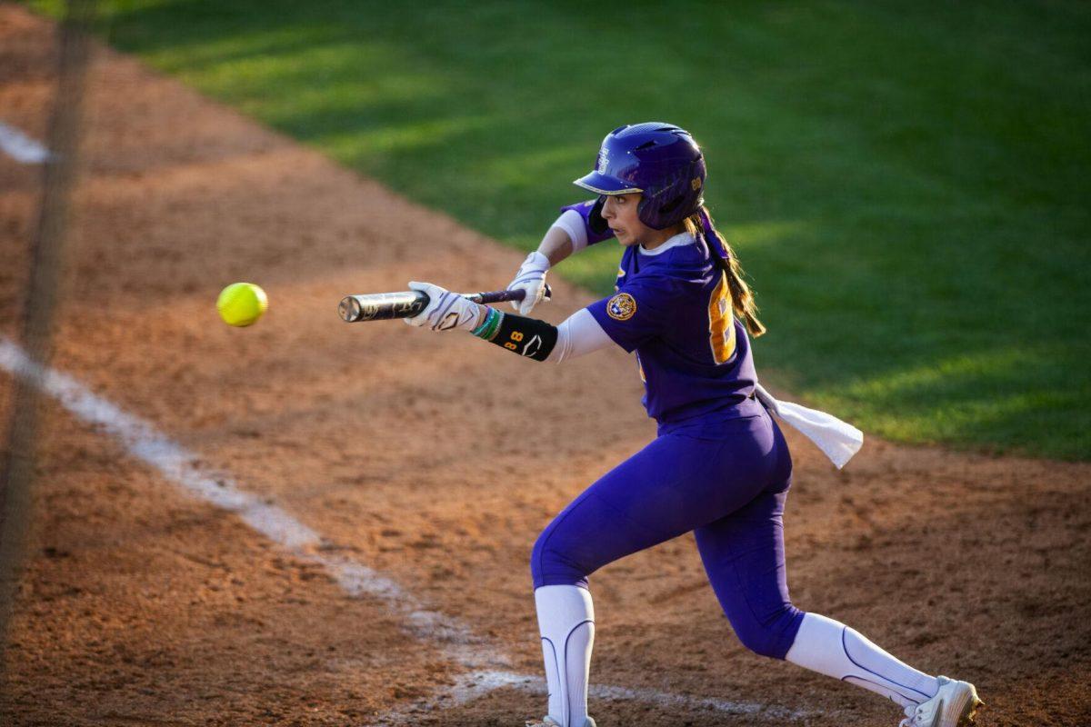 LSU softball redshirt sophomore outfielder Ciara Briggs (88) bunts the ball down Friday, Feb. 11, 2022, during the Tigers' 3-0 win against South Alabama at Tiger Park in Baton Rouge, La.