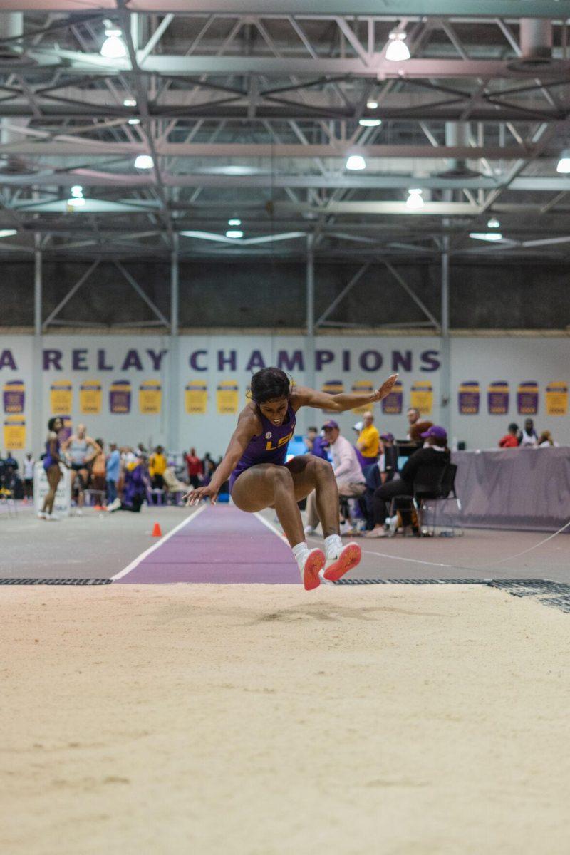 LSU track and field sophomore Serena Bolden stretches out her legs on Friday, Feb. 4, 2022, during the Bayou Bengal indoor track meet at the Carl Maddox Field House on Nicholson Drive in Baton Rouge, La.