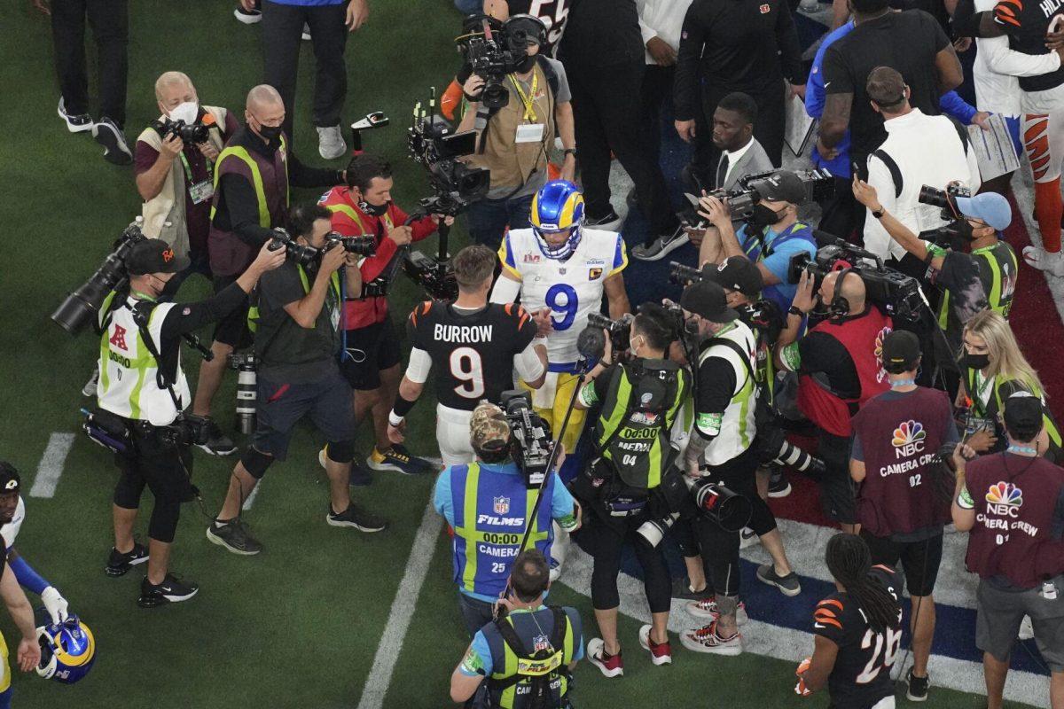 Cincinnati Bengals quarterback Joe Burrow (9) and Los Angeles Rams quarterback Matthew Stafford (9) shake hands at the end of the NFL Super Bowl 56 football game, Sunday, Feb. 13, 2022, in Inglewood, Calif. (AP Photo/Morry Gash)