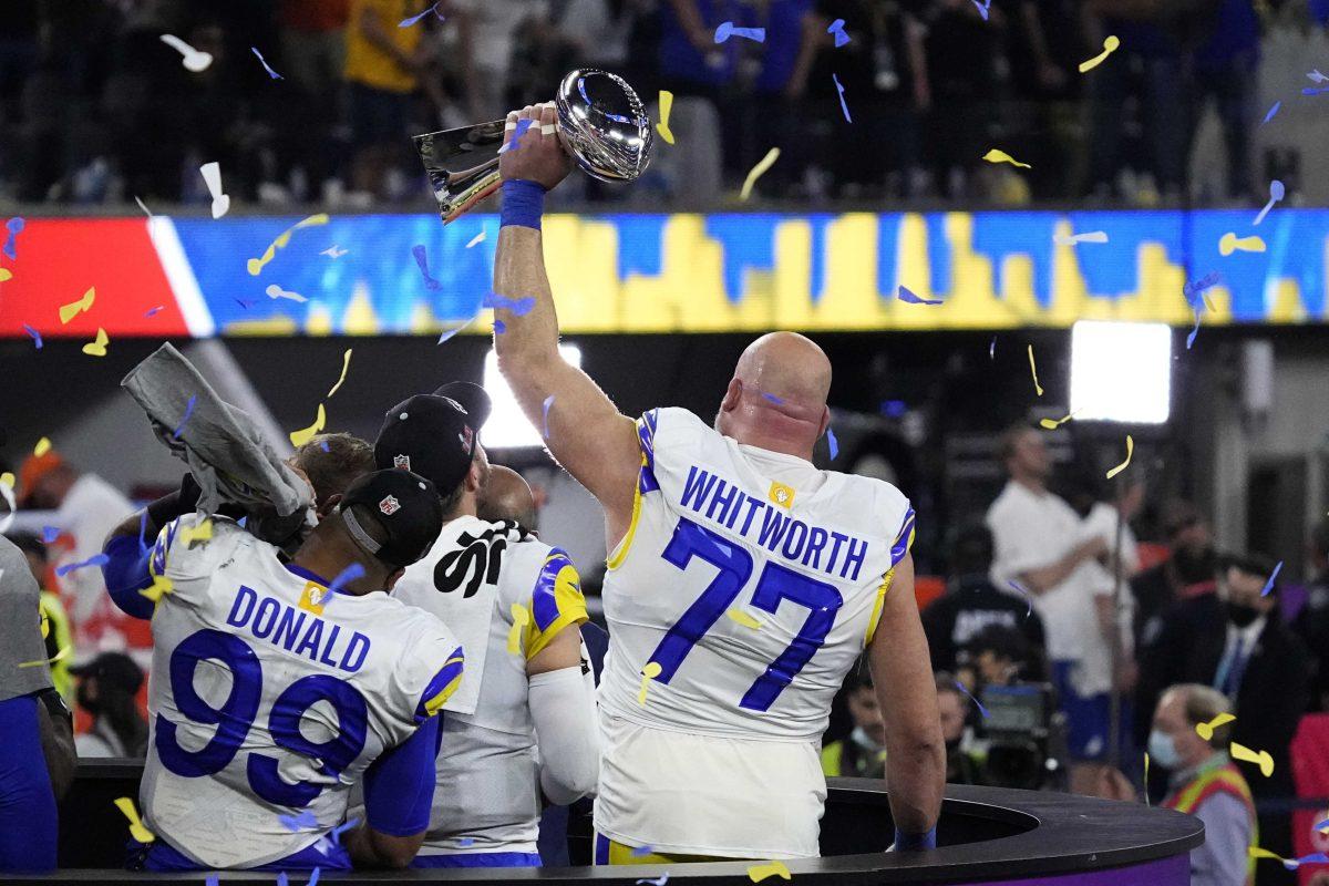 <p>Los Angeles Rams offensive tackle Andrew Whitworth (77) holds the the Lombardi Trophy after the NFL Super Bowl 56 football game Sunday, Feb. 13, 2022, in Inglewood, Calif. The Los Angeles Rams won 23-20. (AP Photo/Julio Cortez)</p>