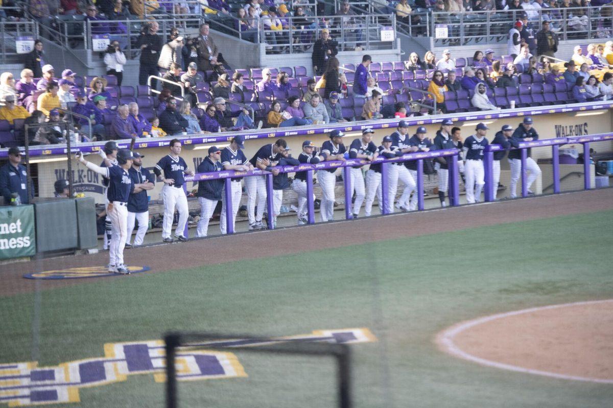 The University of Maine baseball team watches from the dugout Saturday, Feb. 19, 2022, during the Tigers' 17-8 win against the University of Maine at Alex Box Stadium in Baton Rouge, La.