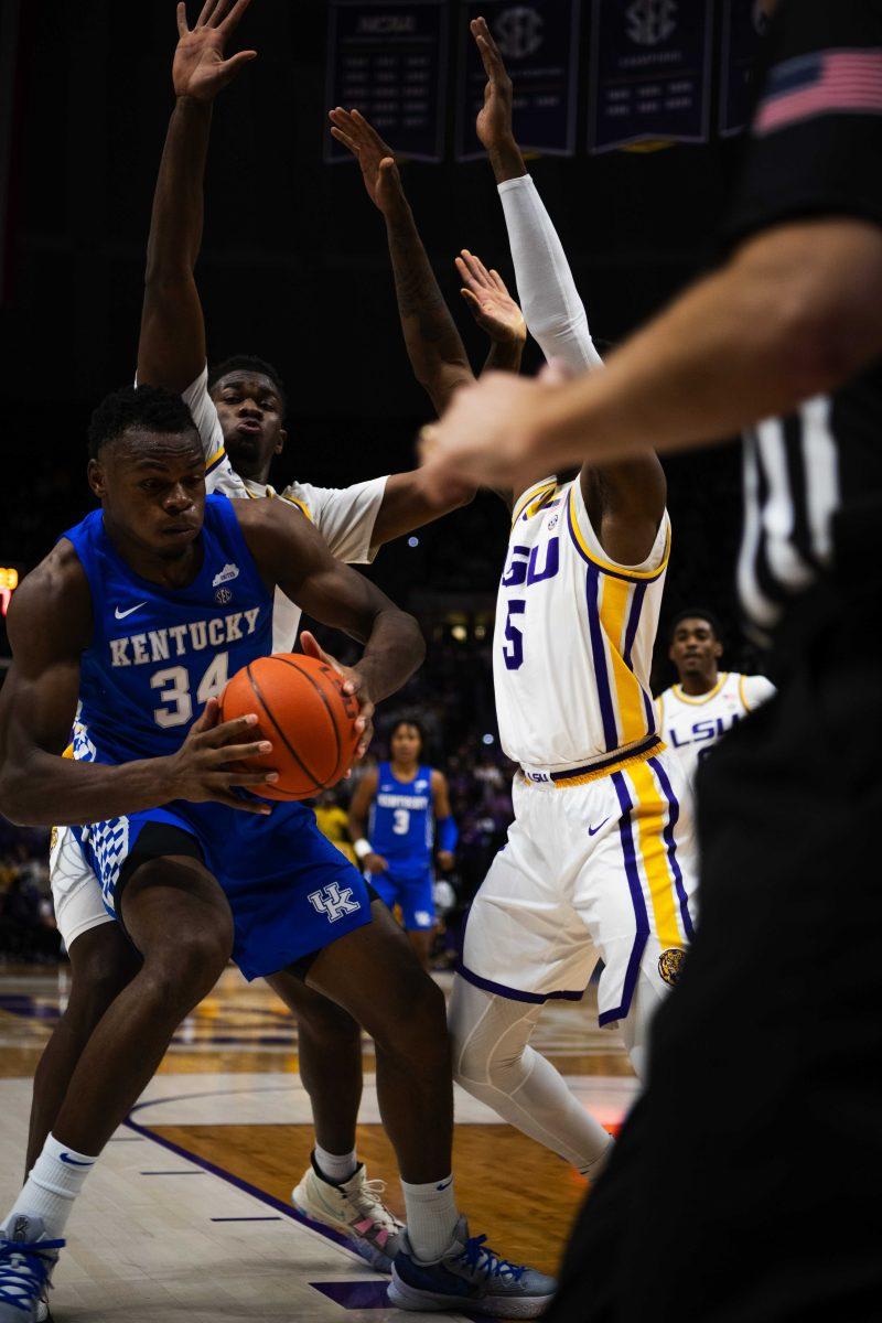 LSU men&#8217;s basketball sophomore forward Mwani Wilkinson (5) and senior forward Darius Days (4) double team against Kentucky junior forward Oscar Tshiebwe (34) Tuesday, Jan. 04, 2022, during LSU&#8217;s 65-60 win against Kentucky in the Pete Maravich Assembly Center on North Stadium Drive in Baton Rouge, La.