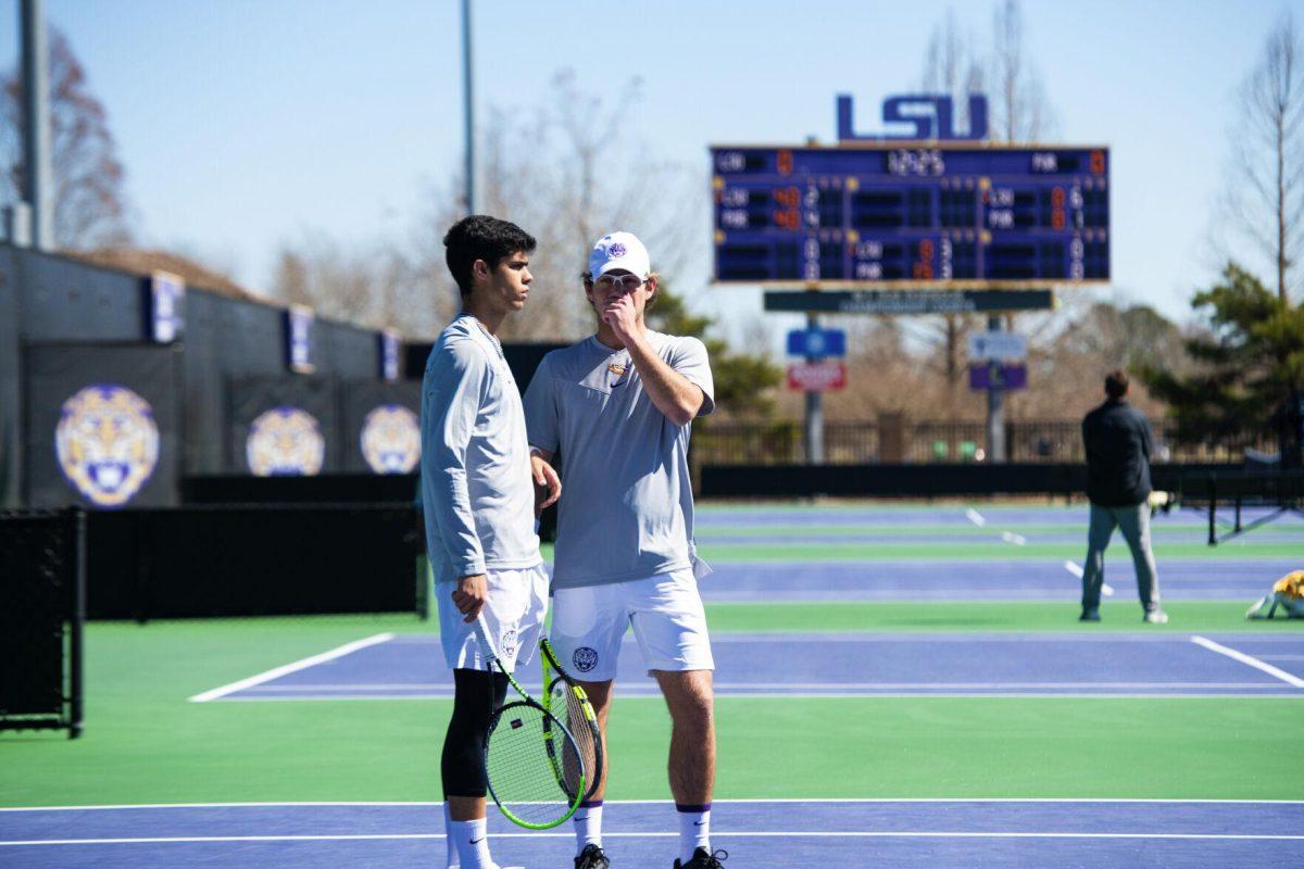 LSU men's tennis sophomore Joao Garca and junior Nick Watson speak to each other Sunday, Feb. 13, 2021 during LSU's 6-1 win over Purdue at the LSU Tennis Complex on Gourrier Avenue in Baton Rouge, La.