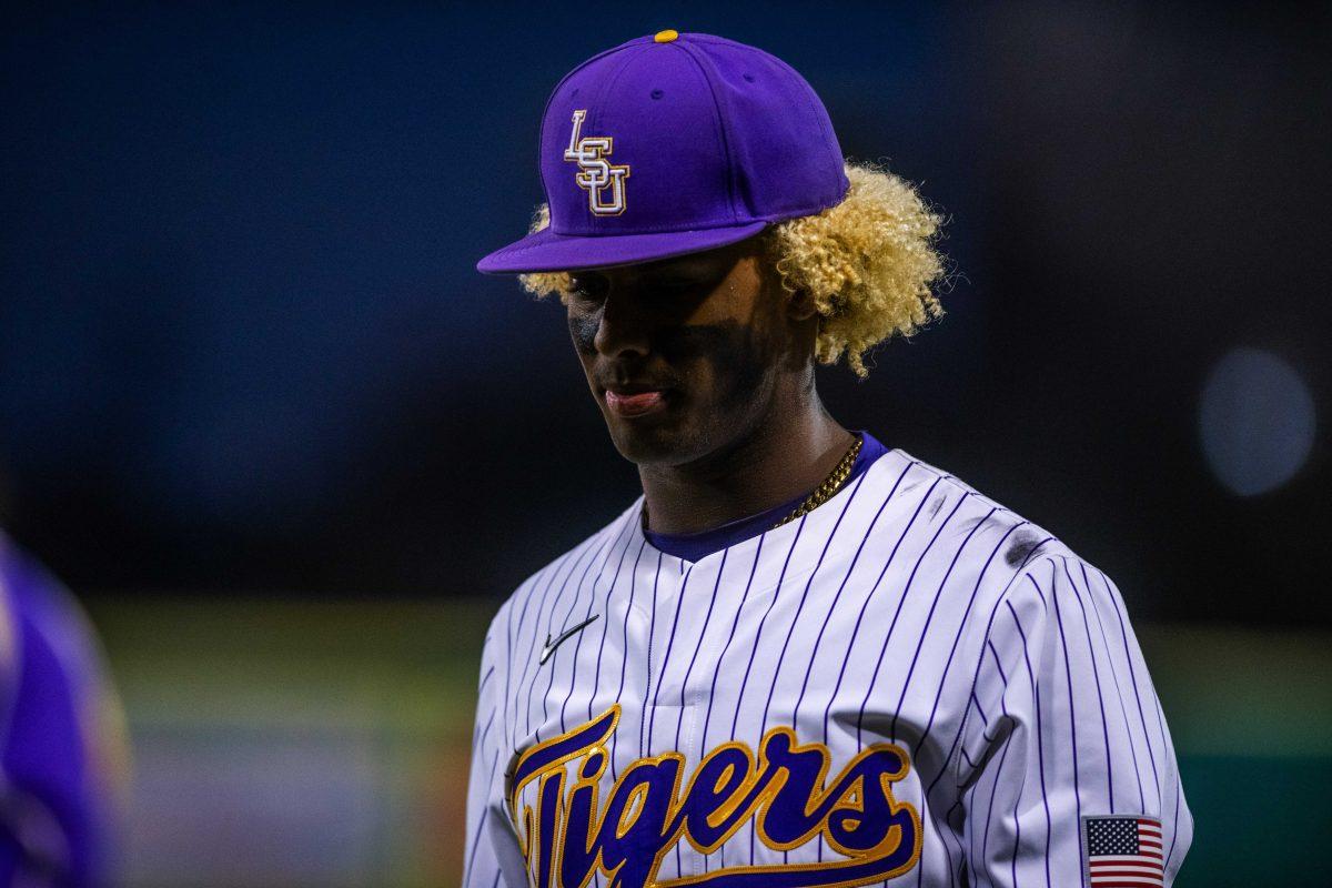 LSU baseball sophomore first baseman Tre Morgan III (18) walks to the dugout Friday, Feb. 18, 2022 before LSU's 13-1 win against Maine at Alex Box Stadium on Gourrier Avenue in Baton Rouge, La.