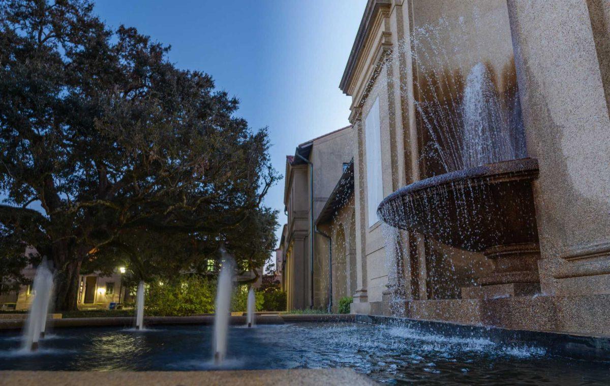 Water shoots up on the night of Wednesday, Jan. 26, 2022, and water leaves the main spout during the day of Saturday, Jan. 22, 2022, from the fountain outside of Dodson Hall on LSU&#8217;s campus in Baton Rouge, La.