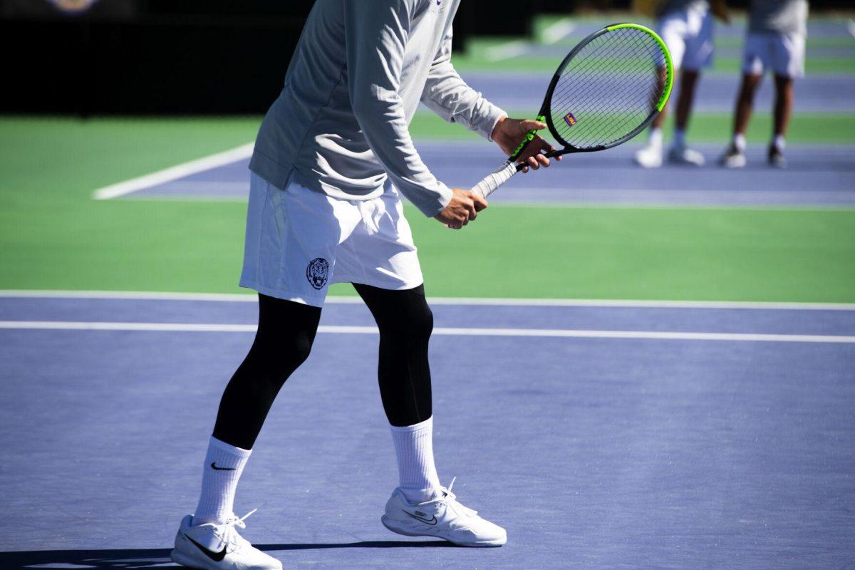 LSU men's tennis sophomore Joao Garca prepares for the serve Sunday, Feb. 13, 2021 during LSU's 6-1 win over Purdue at the LSU Tennis Complex on Gourrier Avenue in Baton Rouge, La.