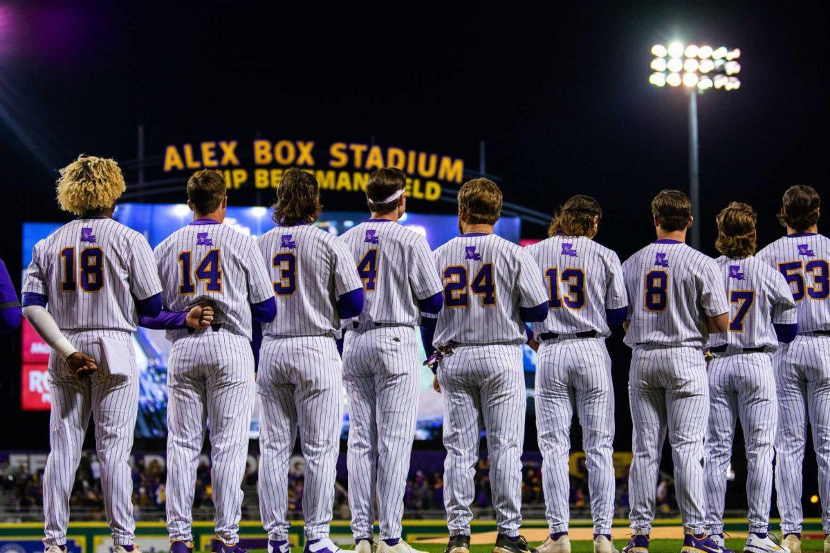 The LSU baseball team stands for the national anthem Friday, Feb. 18, 2022 before LSU's 13-1 win against Maine at Alex Box Stadium on Gourrier Avenue in Baton Rouge, La.