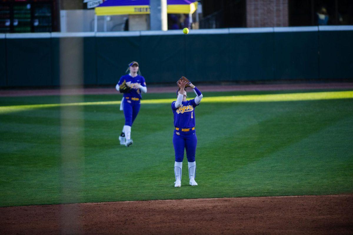 LSU softball freshman infielder Sydney Peterson (1) catches a fly ball Friday, Feb. 11, 2022, during the Tigers' 3-0 win against South Alabama at Tiger Park in Baton Rouge, La.