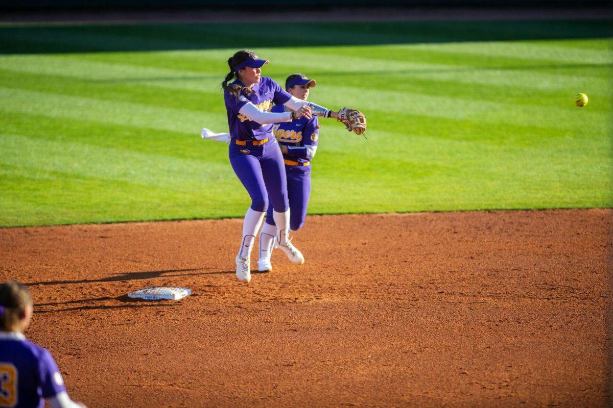 LSU softball redshirt sophomore infielder Taylor Pleasants (17) throws the ball to first Friday, Feb. 11, 2022, during the Tigers' 3-0 win against South Alabama at Tiger Park in Baton Rouge, La.