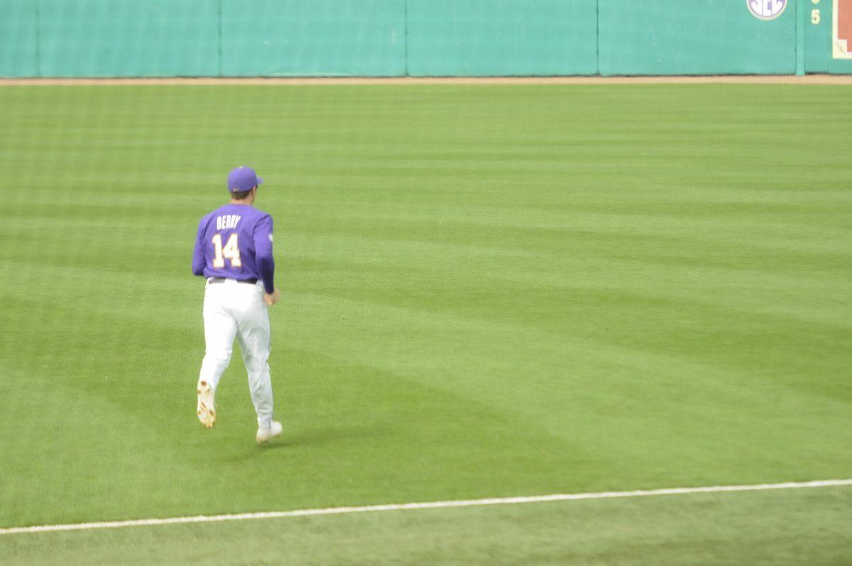 LSU sophomore infielder Jacob Berry (14) runs to his spot Saturday, Feb. 26, 2022, during the Tigers' 9-2 win against Southern University at Alex Box Stadium in Baton Rouge, La.